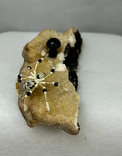 Load image into Gallery viewer, Calcite Display with Dalmatian Jasper Spiderling