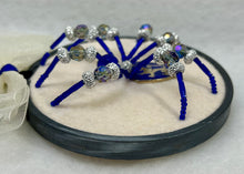 Load image into Gallery viewer, Vintage Metal Lion Shield Cufflink on Cream 4 Inch Hoop Spider