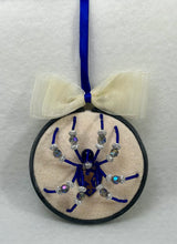 Load image into Gallery viewer, Vintage Metal Lion Shield Cufflink on Cream 4 Inch Hoop Spider
